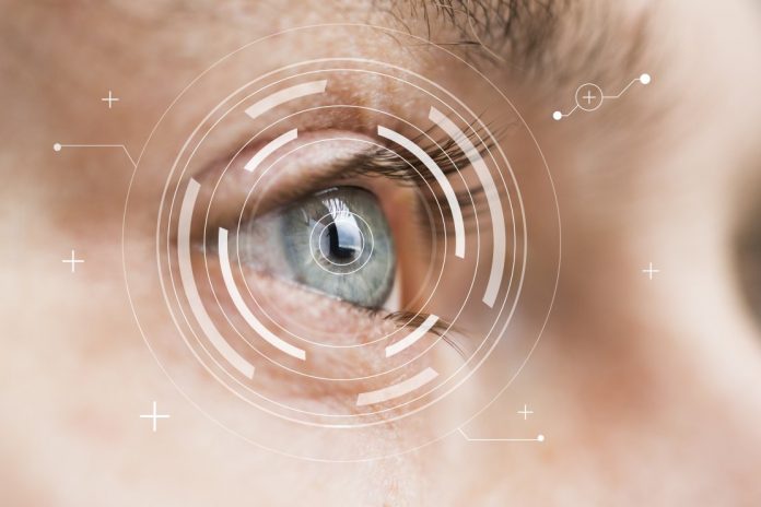 Eye monitoring and treatment in medical. Biometric scan of male eye closeup. Eye monitoring and treatment in medical. Biometric scan of male eye closeup.