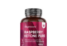 Ketony malinowe: jak naprawdę działają na organizm i czy opłaca się sięgać po ten suplement? butelka suplementu ketonów malinowych z świeżymi malinami na stole