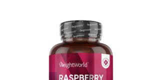 Ketony malinowe: jak naprawdę działają na organizm i czy opłaca się sięgać po ten suplement? butelka suplementu ketonów malinowych z świeżymi malinami na stole