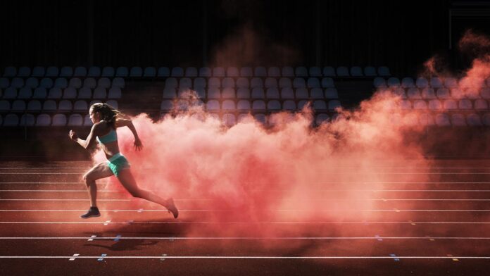 athlete running in red smoke athlete running in red smoke